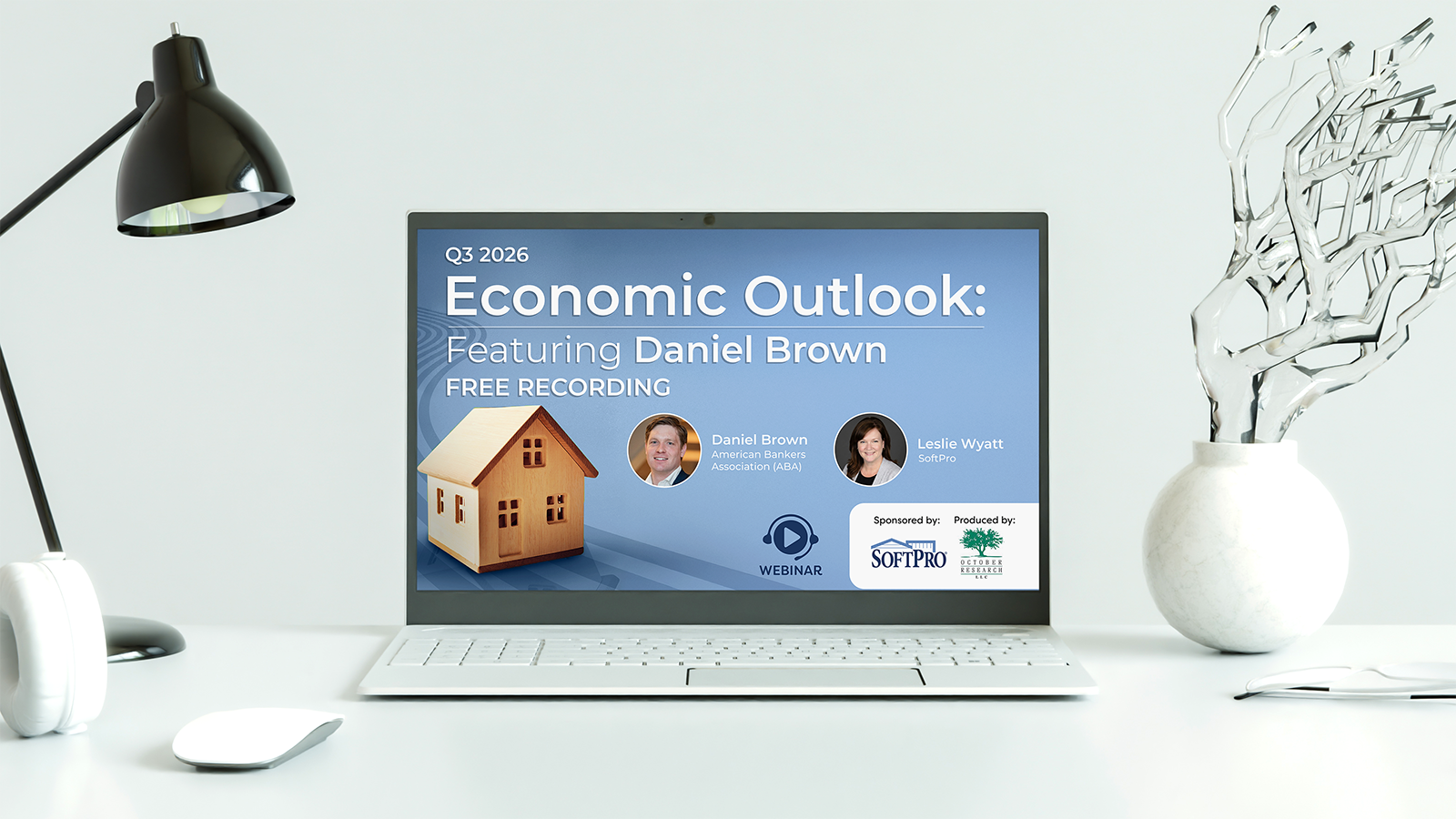 Laptop displaying a webinar recording titled “Q3 2026 Economic Outlook” featuring Daniel Brown of the American Bankers Association and Leslie Wyatt of SoftPro